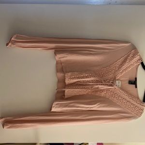 Brand new. Long sleeve top.